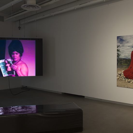 Video performance and print of Lori Blondeau displayed in the gallery