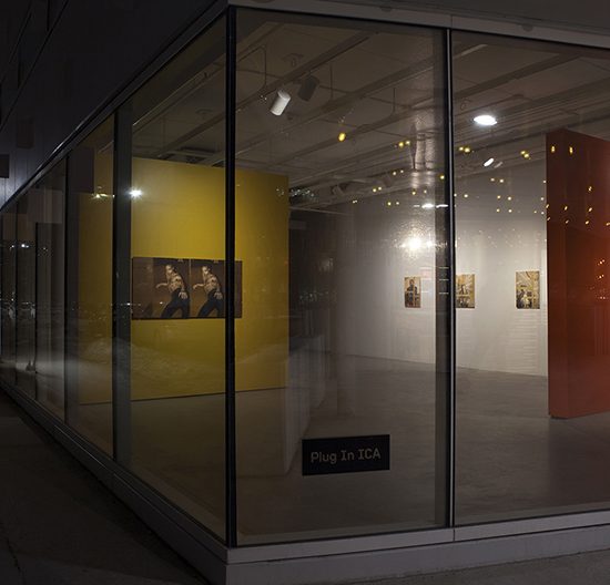 View of the exhibition from outside the window at night
