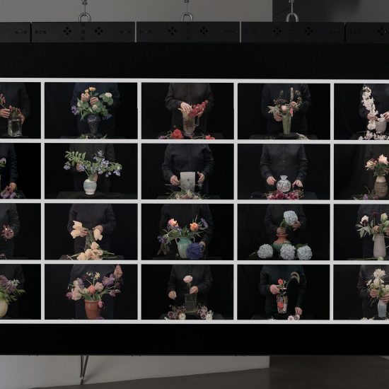A large screen hangs with 20 different frames on the screen